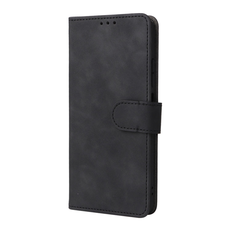 Black leather flip phone case with magnetic closure and stitched hand strap