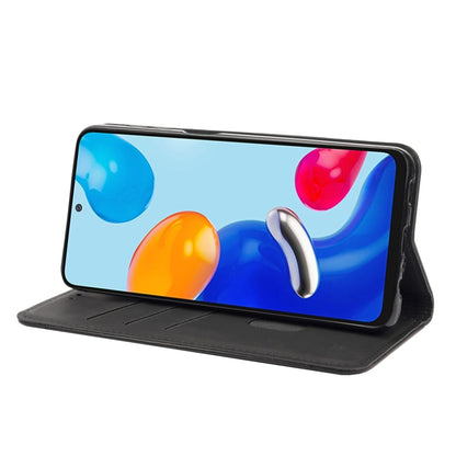 Black magnetic leather flip phone case propped as a stand