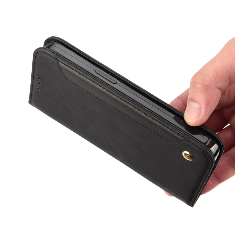 Black magnetic leather phone case close-up with edge stitching and snap button