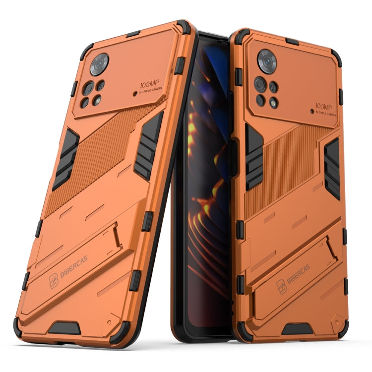 Orange TPU shockproof phone case with invisible holder, rugged armor panels.