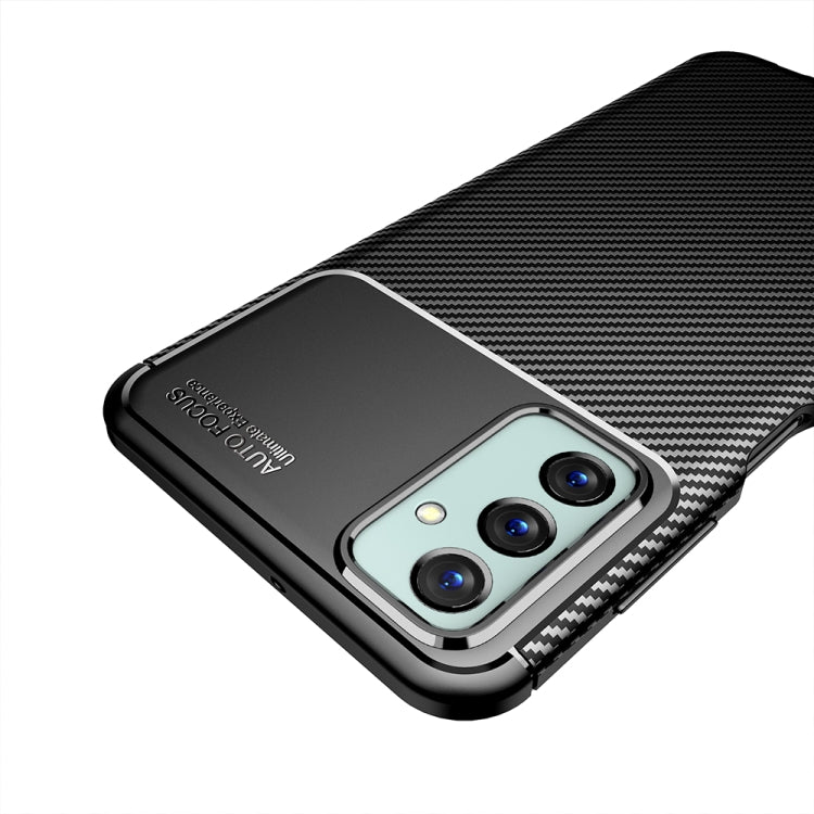 Black carbon fiber TPU phone case with triple camera cover and raised bezel edges