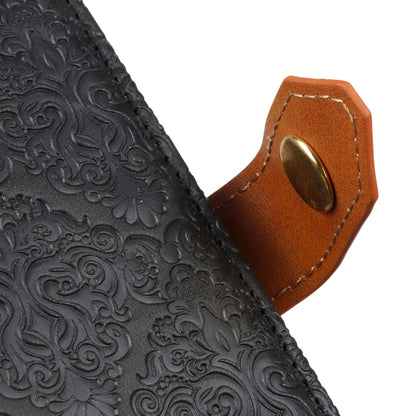 Black embossed floral leather with tan clasp loop and top edge