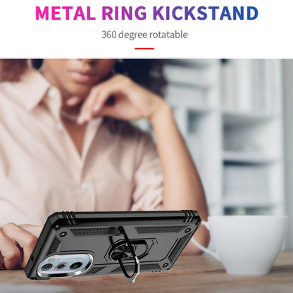 Black phone case with metal ring kickstand shown in use on a desk