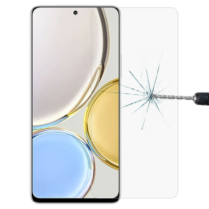 Tempered glass screen protector film on smartphone display, protecting from cracks.