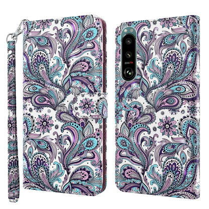 White phone case with purple and teal paisley floral pattern, wrist strap, back camera area
