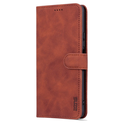 Brown flip leather phone case close-up with top speaker cutout and side strap
