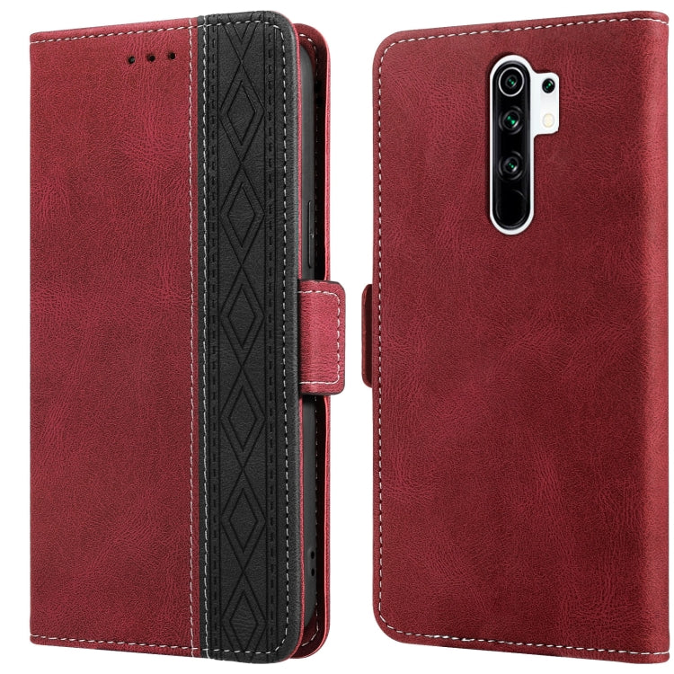 Red leather phone case with folio flap, side stitching, and patterned card slot interior