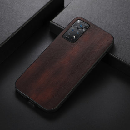Brown textured PU phone case with camera cutout, shown at an angled side view