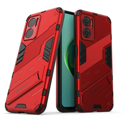 Red rugged shockproof phone case with raised armor edges and built-in holder