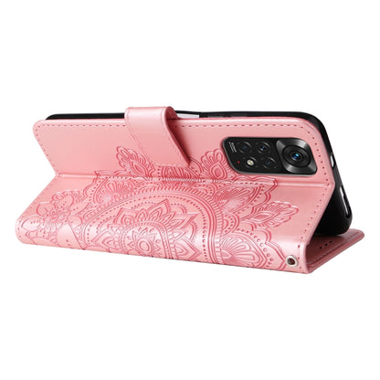 Rose gold leather horizontal flip phone case with embossed 7-petal floral pattern and stand