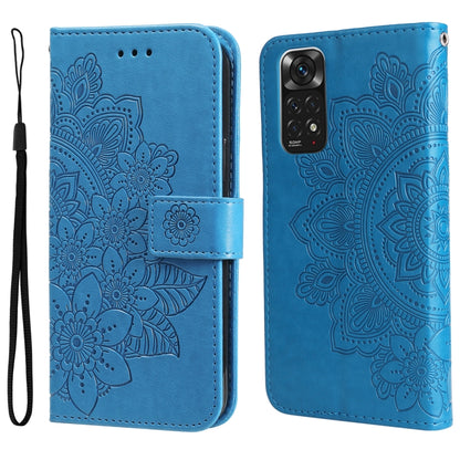 Blue leather flip phone case with embossed 7-petal floral pattern and wrist strap