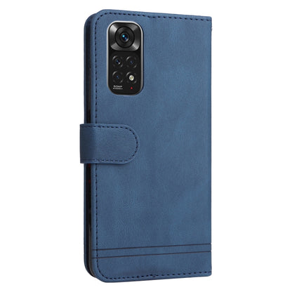 Blue leather flip phone case with camera cover flap and metal-button closure.