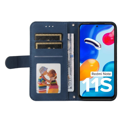 Blue leather flip phone case with card slots, lanyard strap, and metal button.