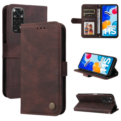 Brown leather flip phone case with metal button, card slots, and camera cutout.