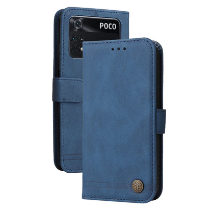 Blue leather flip phone case with side strap and metal button detail