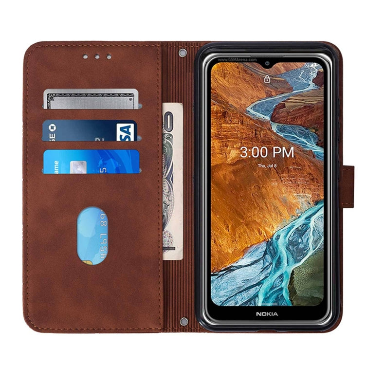 Brown flip phone case interior with card slots and magnetic closure, phone in cradle