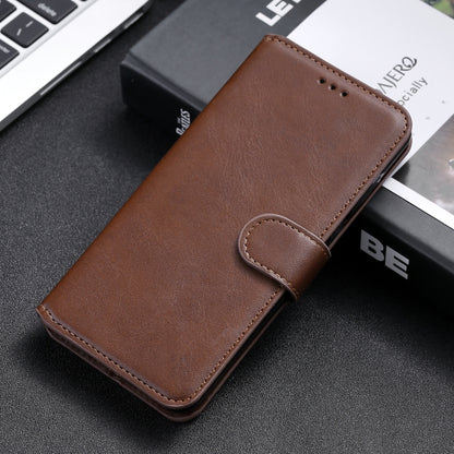 Brown horizontal flip leather phone case with card strap tab, PU/TPU texture.