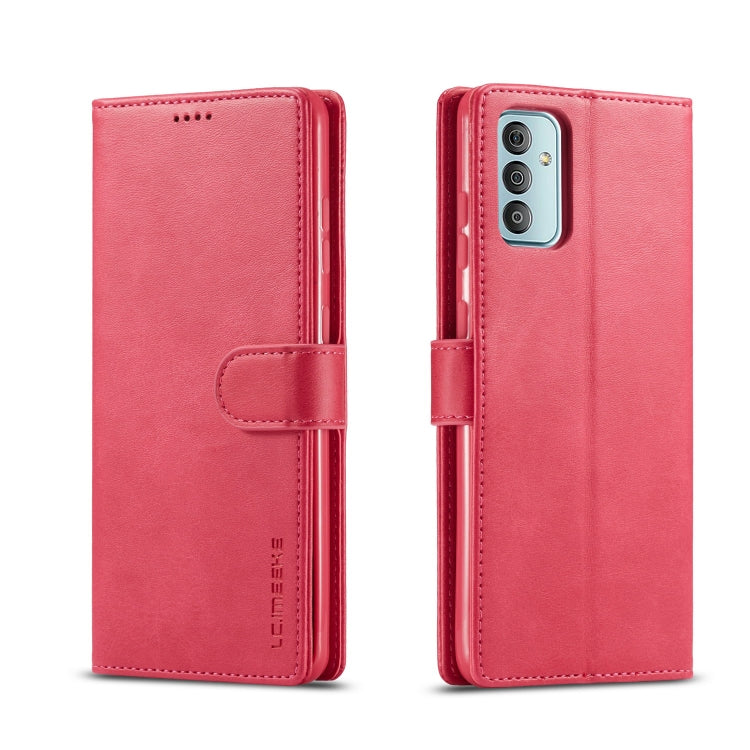 Pink leather phone flip case with side strap closure and camera cutout