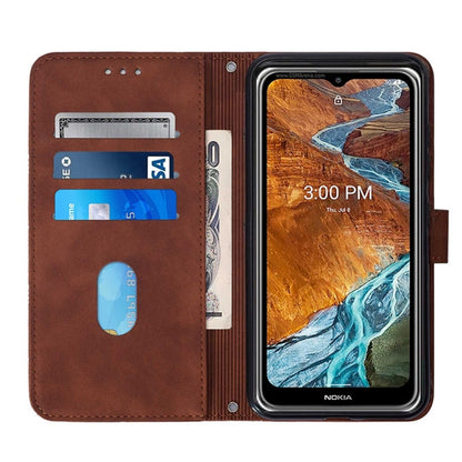 Brown flip phone case with built-in card holder slots and side strap ring.