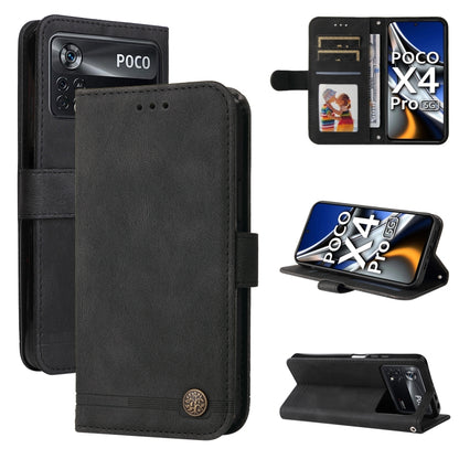 Black leather wallet phone case with metal button, folio stand and card slots.