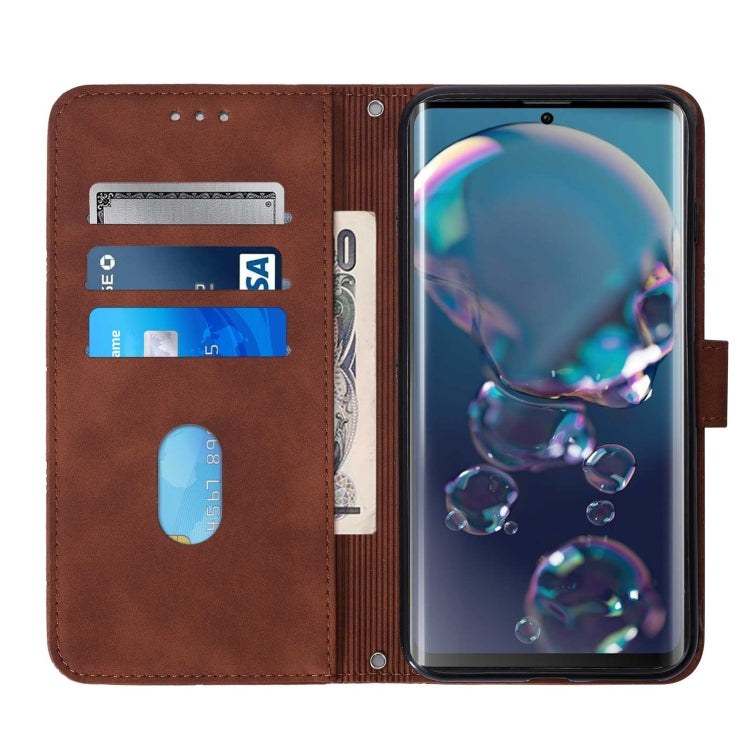 Brown leather flip phone case with card slots and elastic pocket, phone cover open.