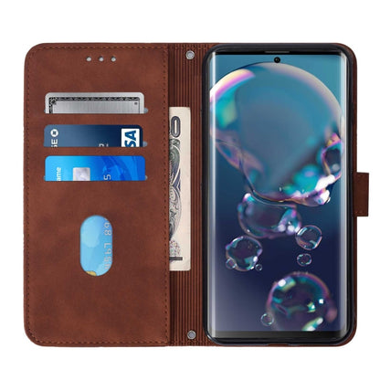 Brown leather flip phone case with card slots and elastic pocket, phone cover open.