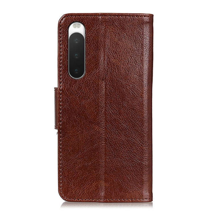 Brown nappa leather phone wallet case with textured finish and camera cutout, back view.