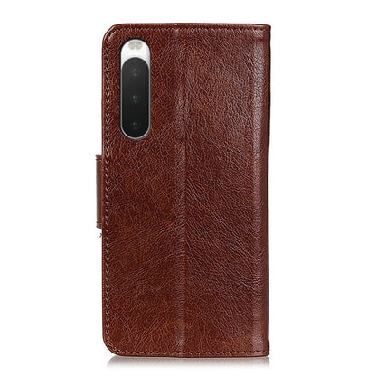 Brown nappa leather phone wallet case with textured finish and camera cutout, back view.