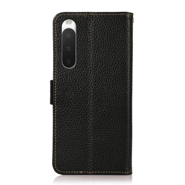 Black genuine leather flip phone case with camera cutout and side magnetic closure