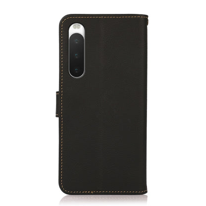 KHAZNEH genuine leather flip phone case, black, showing camera cutout and side strap
