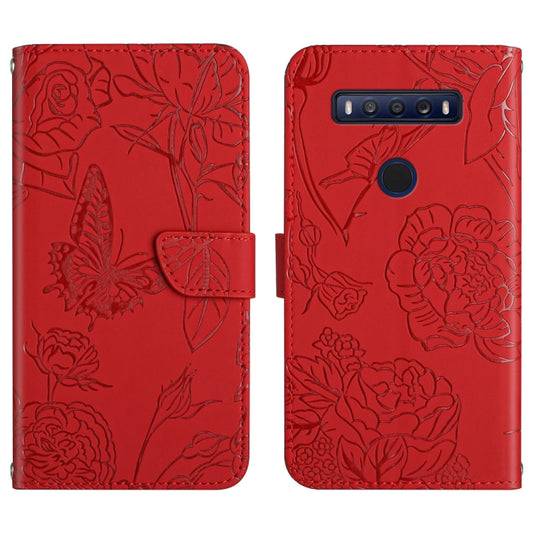 Red embossed leather-look phone case with butterfly and flower pattern, folio with strap