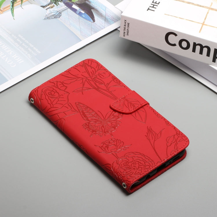 Red embossed leather phone case with butterfly and peony pattern, folded closed