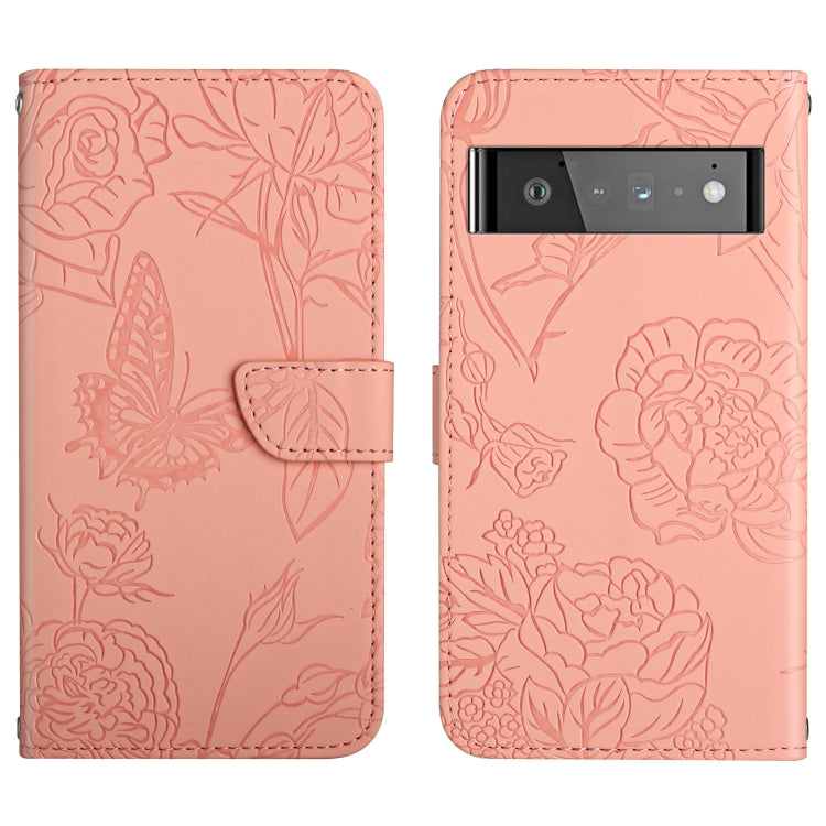 Pink embossed leather phone case with butterfly and floral design, camera window