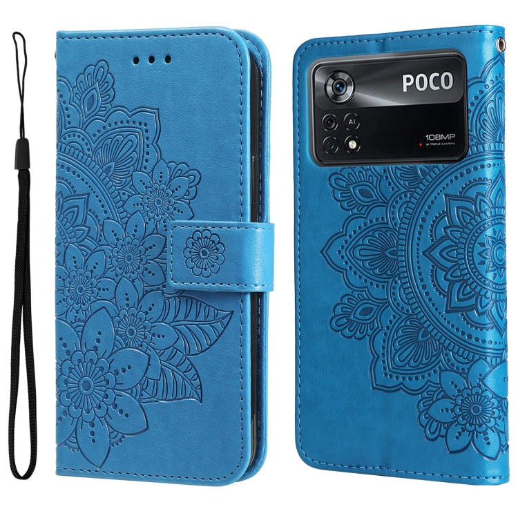 Blue embossed flower flip phone case with magnetic clasp and wrist strap.