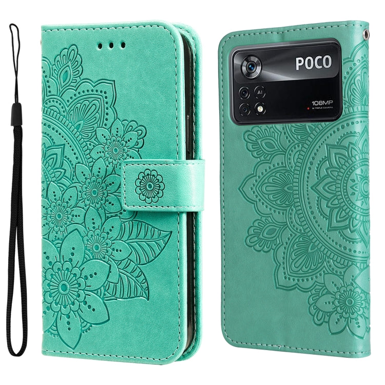 Mint green embossed flower flip phone case with magnetic clasp and wrist strap.