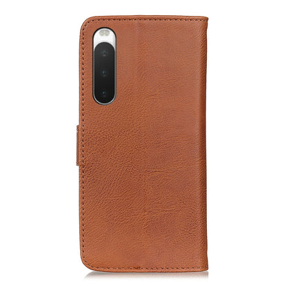 Brown leather flip phone case with camera cutout and stitched edge