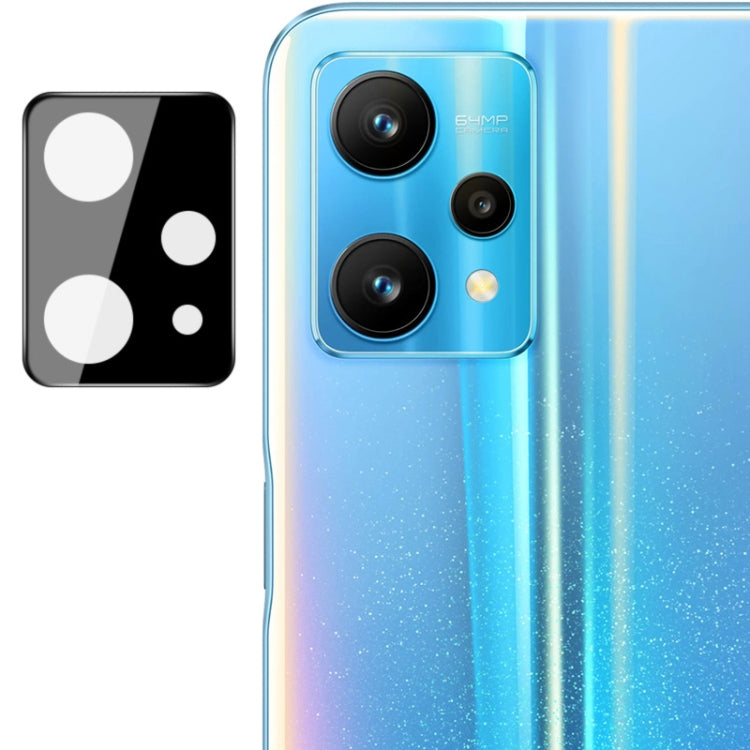 Integrated rear camera lens glass film with black lens cap over triple camera lenses
