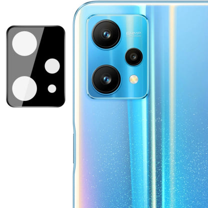 Integrated rear camera lens glass film with black lens cap over triple camera lenses