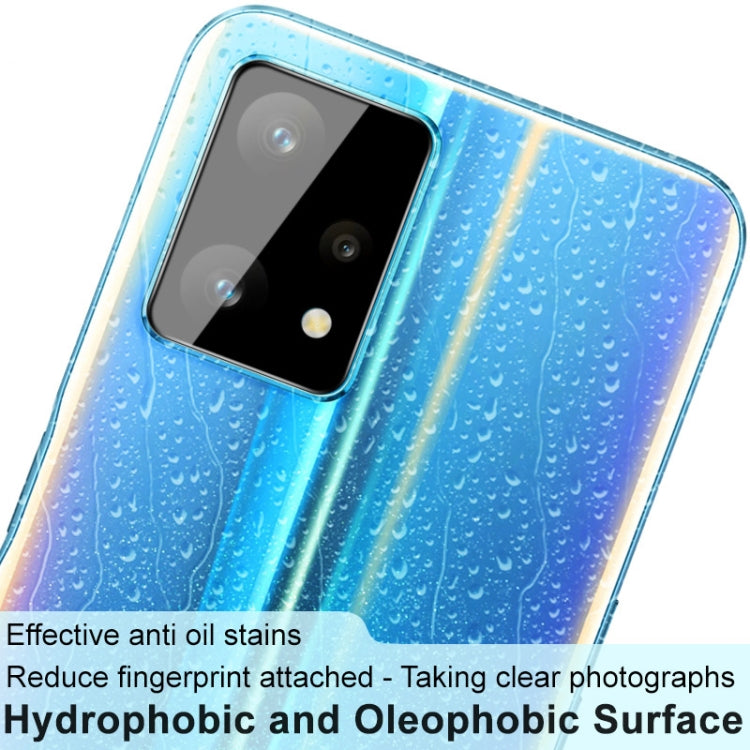 Close-up of blue phone rear with black camera lens cap and clear lens glass film