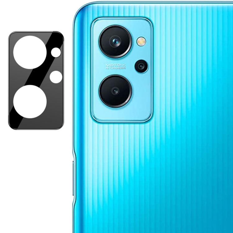 Integrated rear camera lens glass film with black lens cap on blue phone back