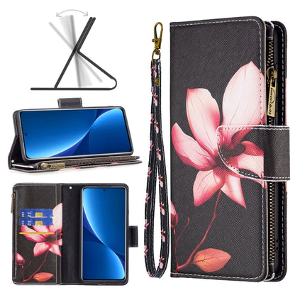 Dark gray leather phone case with zip closure, pink magnolia floral print, and card slots.
