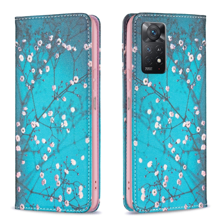 Turquoise magnetic leather phone case with plum blossom pattern and camera cutout.