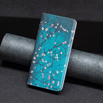 Turquoise magnetic leather phone case with plum blossom pattern on a dark couch.