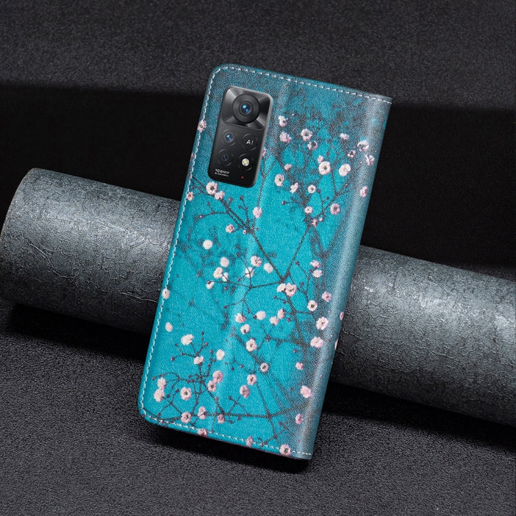 Turquoise magnetic leather phone case with plum blossom pattern, camera side visible.
