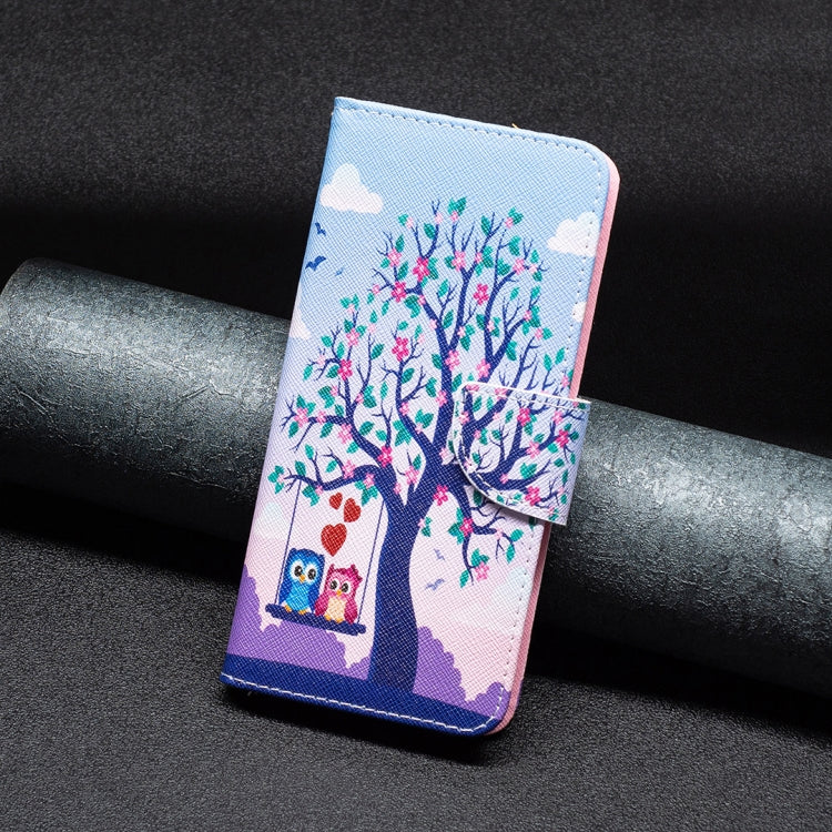 Tree and owl folio phone case with blue stitching, textured outer and side strap