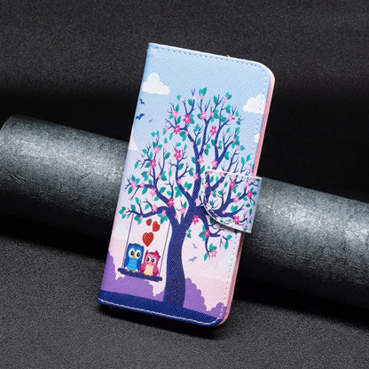 Tree and owl folio phone case with blue stitching, textured outer and side strap