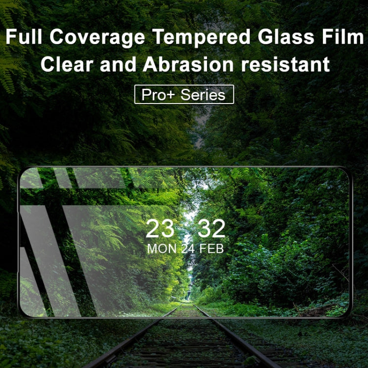 Tempered glass screen protector film covering phone display, clear surface