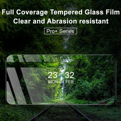Tempered glass screen protector film covering phone display, clear surface