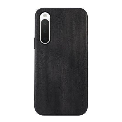 Black textured PU phone case with camera cutout and slim side openings.