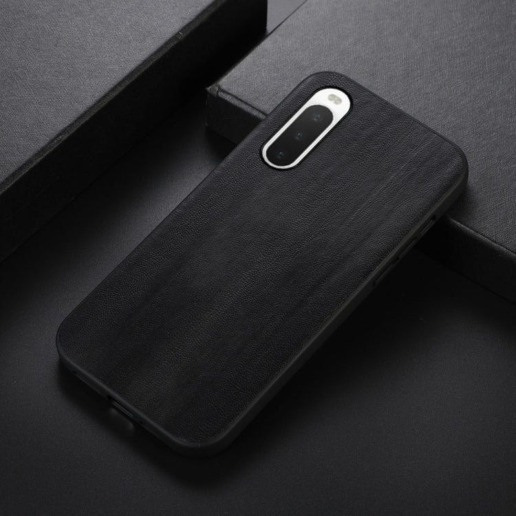 Dark textured PU phone case with camera cutout and slim side openings.